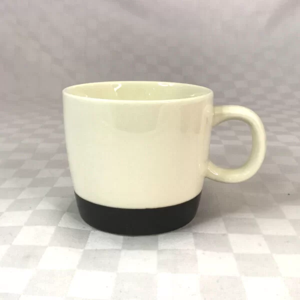 cream and green ceramic mug